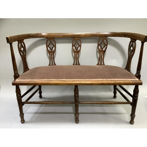 464 - An Edwardian polished beech and line inlaid occasional sofa with pierced splat back, upholstered sea... 