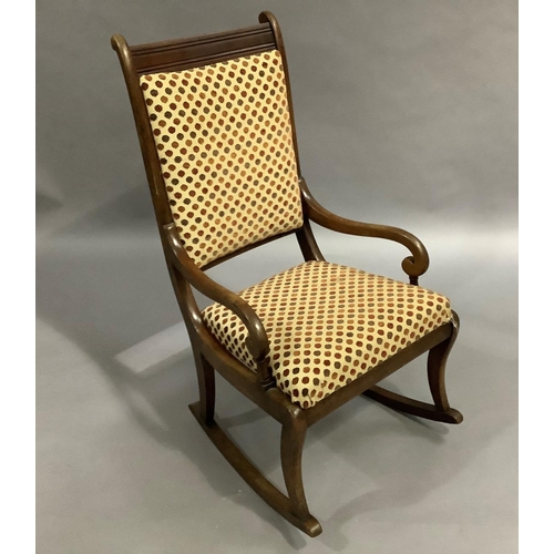 468 - A Victorian mahogany rocking chair, upholstered in velvet spot fabric