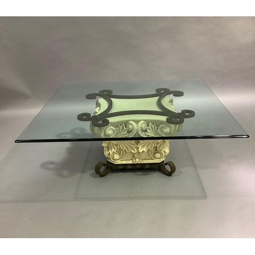 448 - A large glass topped coffee table on a faux stone and cast iron pedestal base, 131cm square x 49cm h... 