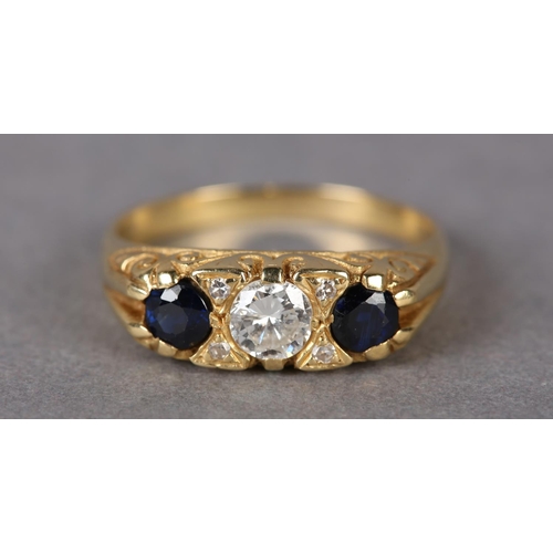 313 - A SAPPHIRE AND DIAMOND THREE STONE RING set to the centre with a brilliant cut diamond flanked by tw... 