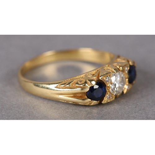 313 - A SAPPHIRE AND DIAMOND THREE STONE RING set to the centre with a brilliant cut diamond flanked by tw... 