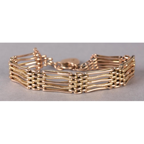 309 - A VICTORIAN GATE BRACELET in 9ct rose gold, the links textured and polished, padlock fastener, appro... 