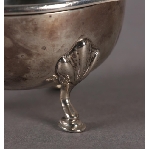 239 - A GEORGE V SILVER TEA STRAINER AND BOWL by Greenwood & Sons, Huddersfield with knurled scroll handle... 