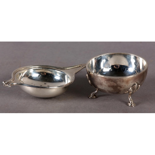 239 - A GEORGE V SILVER TEA STRAINER AND BOWL by Greenwood & Sons, Huddersfield with knurled scroll handle... 