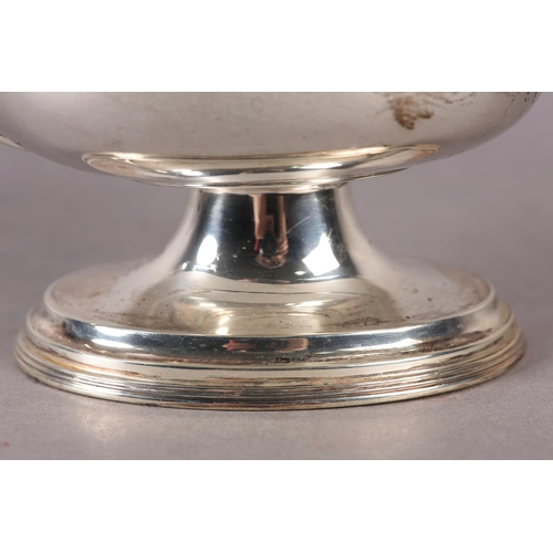 240 - A LATE VICTORIAN SILVER SAUCE BOAT of oval outline, C scroll handle, reeded edge and stepped foot, a... 