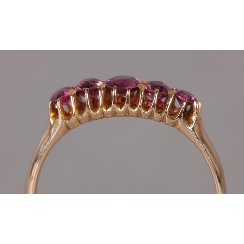 328 - A VICTORIAN RHODALITE GARNET FIVE STONE RING in 9ct rose gold, the graduated circular faceted stones... 