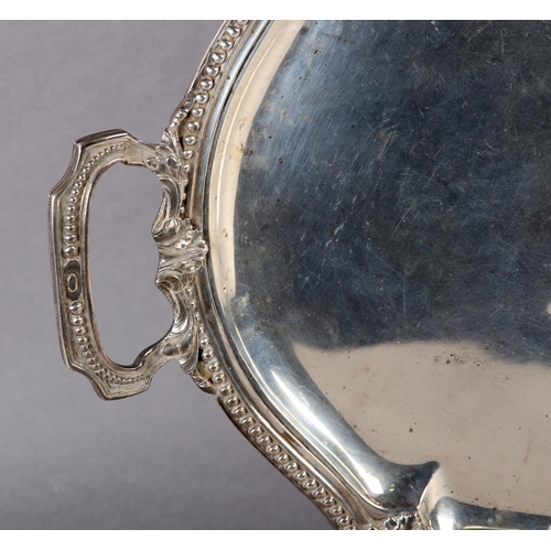 269 - AN EARLY 20TH CENTURY FRENCH SILVER TRAY of oval outline with beaded and acanthus rim and conforming... 