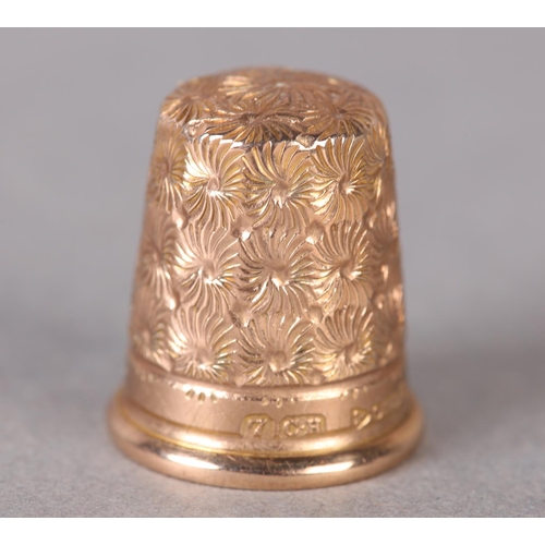 285 - A GEORGE V THIMBLE in 9ct gold by Charles Horner Ltd, all over dandelion seed patterned in original ... 