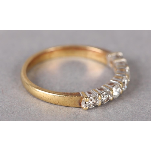 325 - A DIAMOND HALF HOOP RING in 18ct gold, the brilliant cut stones set in line, total approximate diamo... 