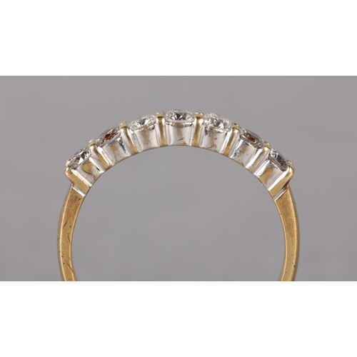 325 - A DIAMOND HALF HOOP RING in 18ct gold, the brilliant cut stones set in line, total approximate diamo... 