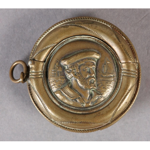 275 - AN EDWARD VII NOVELTY VESTA CASE of circular outline as a lifebuoy with the raised portrait of a bea... 