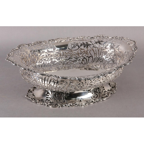 206 - AN EDWARD VII SILVER BASKET  retailed by  Ryrie Brothers of Toronto of oval outline with shell and C... 