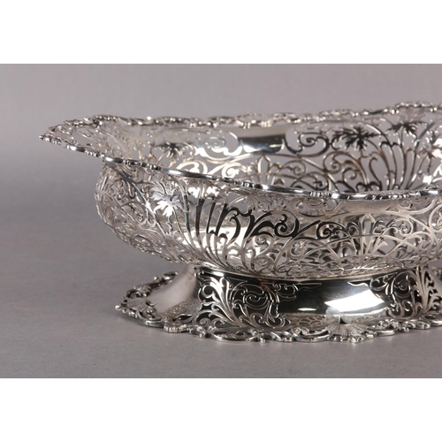 206 - AN EDWARD VII SILVER BASKET  retailed by  Ryrie Brothers of Toronto of oval outline with shell and C... 