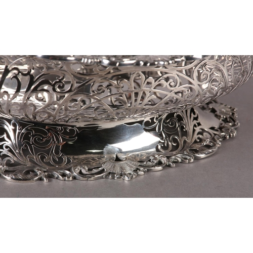 206 - AN EDWARD VII SILVER BASKET  retailed by  Ryrie Brothers of Toronto of oval outline with shell and C... 