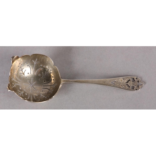 258 - A SCOTTISH SILVER TEA STRAINER c.1970, with pierced and engraved thistle design, hallmarked Edinburg... 