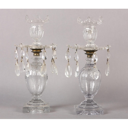 191 - A PAIR OF 19TH CENTURY GLASS CANDLESTICKS the screw off sconces having scalloped rim and panel cut b... 