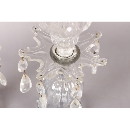 191 - A PAIR OF 19TH CENTURY GLASS CANDLESTICKS the screw off sconces having scalloped rim and panel cut b... 