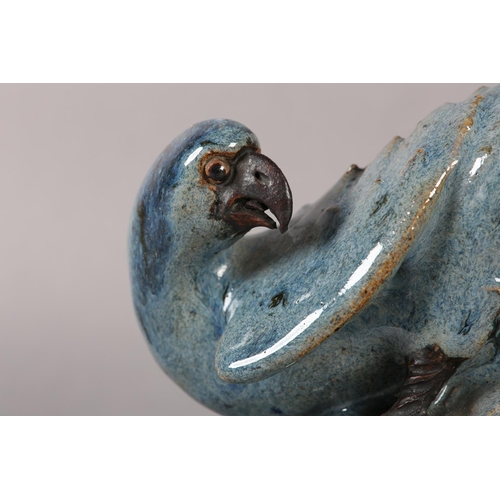 167 - A CHINESE STONEWARE FIGURE OF A HAWK perched on a rock, blue-grey glaze, impressed signature to unde... 