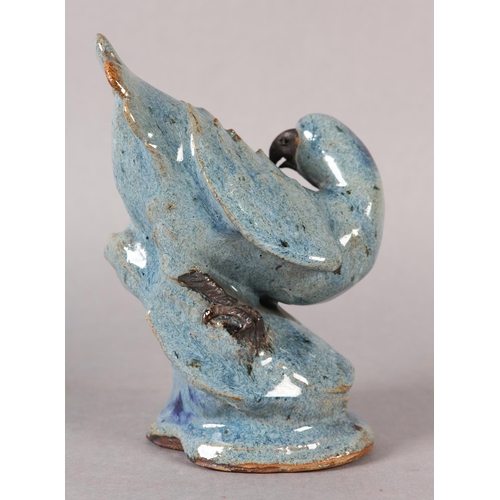 167 - A CHINESE STONEWARE FIGURE OF A HAWK perched on a rock, blue-grey glaze, impressed signature to unde... 