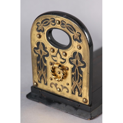 89 - A MID 19TH CENTURY EBONISED AND CUT BRASS MOUNTED BOOK SLIDE, the end panels of arched outline, pier... 