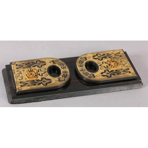 89 - A MID 19TH CENTURY EBONISED AND CUT BRASS MOUNTED BOOK SLIDE, the end panels of arched outline, pier... 