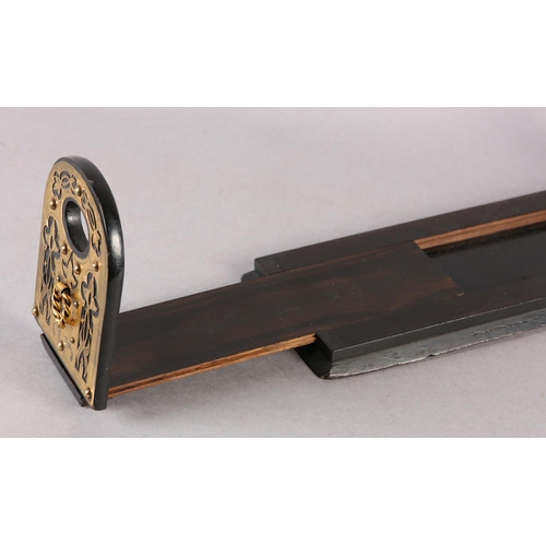 89 - A MID 19TH CENTURY EBONISED AND CUT BRASS MOUNTED BOOK SLIDE, the end panels of arched outline, pier... 