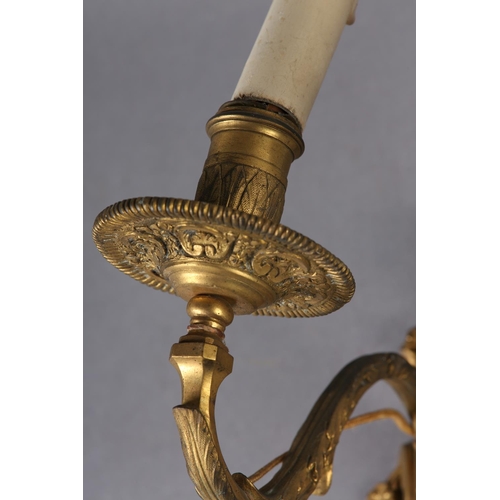 71 - A PAIR OF GILT METAL WALL SCONES CAST with the bust of an emperor and empress above a floral swagged... 