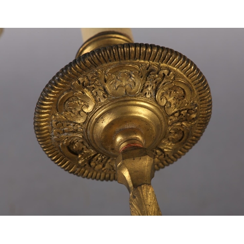 71 - A PAIR OF GILT METAL WALL SCONES CAST with the bust of an emperor and empress above a floral swagged... 