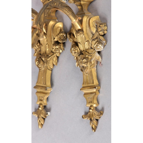 71 - A PAIR OF GILT METAL WALL SCONES CAST with the bust of an emperor and empress above a floral swagged... 