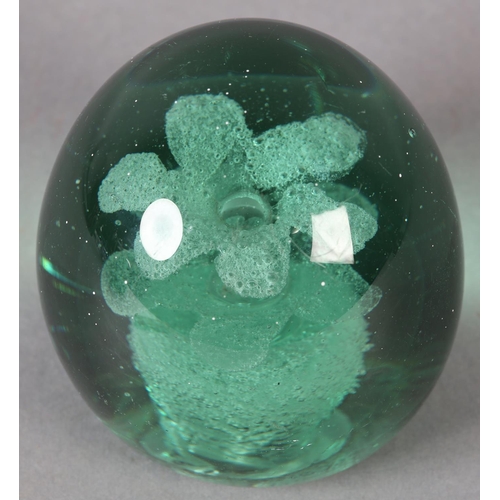 182 - A 19TH CENTURY GREEN GLASS DUMP with flower pot inclusion, 9cm high