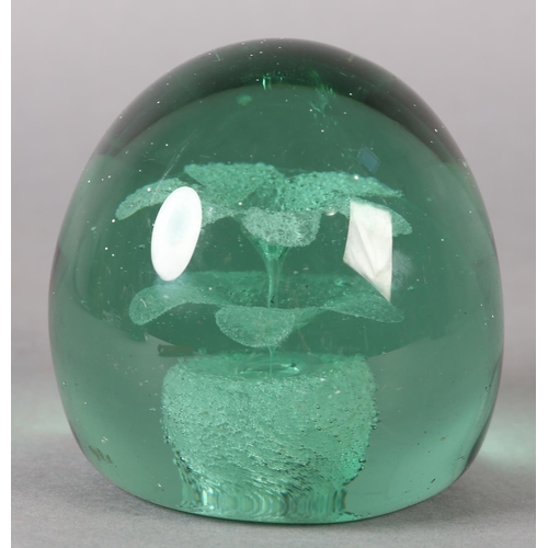 182 - A 19TH CENTURY GREEN GLASS DUMP with flower pot inclusion, 9cm high