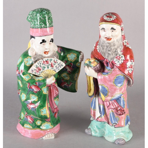 166 - TWO CHINESE CERAMIC FIGURES OF DEITIES, in elegant robes and head-dress, one holding a basket of fru... 