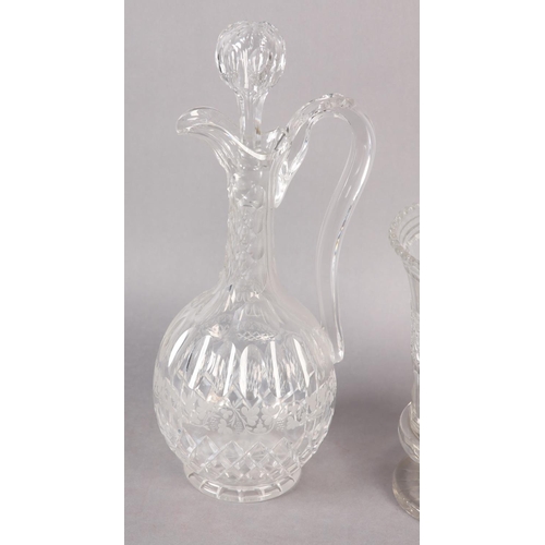 188 - A VICTORIAN CUT WINE EWER, having a faceted neck above cut oval panels, a band of etched grapevine a... 