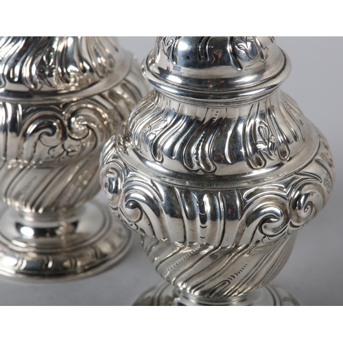 242 - A PAIR OF GEORGE II SILVER CADDIES, Alexander Johnson, London 1757, of writhen baluster vase form wi... 