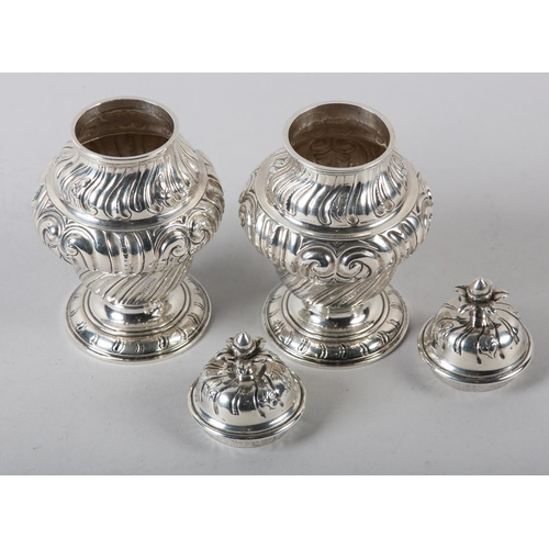 242 - A PAIR OF GEORGE II SILVER CADDIES, Alexander Johnson, London 1757, of writhen baluster vase form wi... 