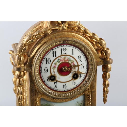 95 - A 19TH CENTURY FRENCH GILT METAL AND PORCELAIN MANTEL CLOCK having a circular dial with black Arabic... 