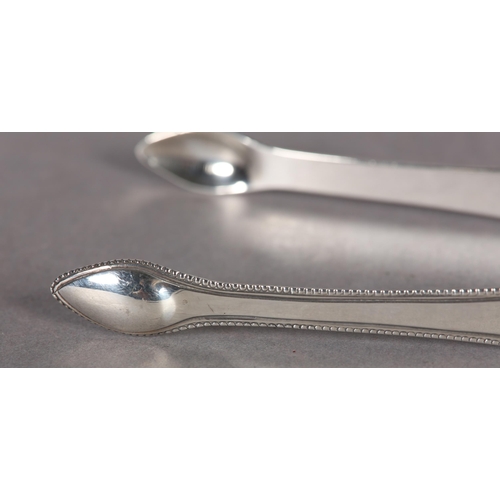 227 - A PAIR OF GEORGE III SILVER SUGAR TONGS with beaded rims, Hester Bateman, approximate weight 1oz