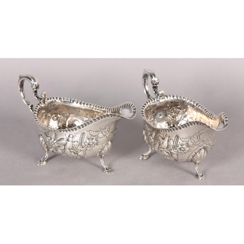 233 - A PAIR OF IRISH GEORGE III SILVER SAUCE BOATS,  Dublin 1770, John Craig, with punchwork rims the bod... 