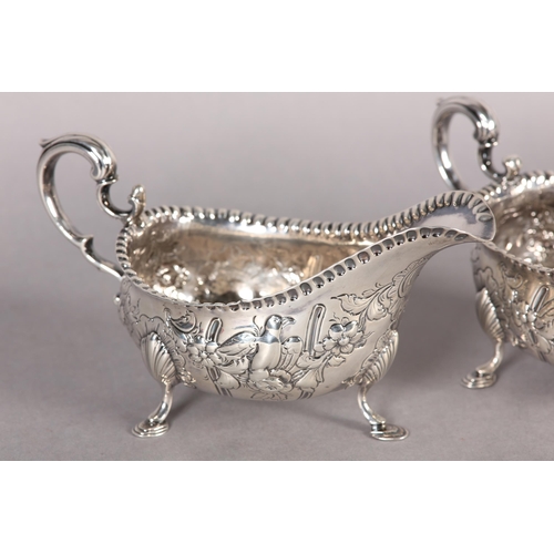 233 - A PAIR OF IRISH GEORGE III SILVER SAUCE BOATS,  Dublin 1770, John Craig, with punchwork rims the bod... 