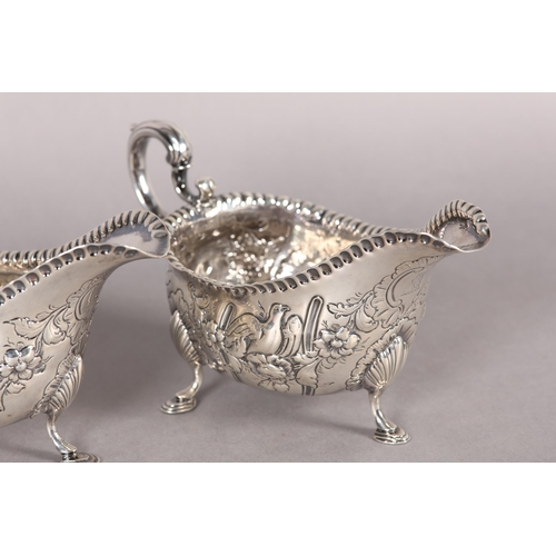 233 - A PAIR OF IRISH GEORGE III SILVER SAUCE BOATS,  Dublin 1770, John Craig, with punchwork rims the bod... 