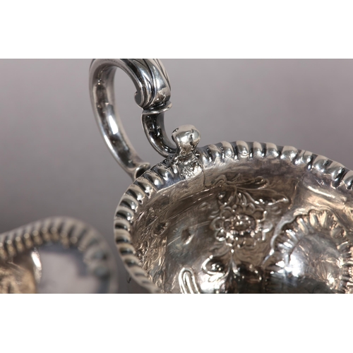 233 - A PAIR OF IRISH GEORGE III SILVER SAUCE BOATS,  Dublin 1770, John Craig, with punchwork rims the bod... 