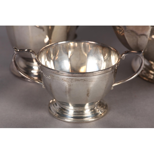 238 - A FOUR PIECE SILVER TEA SET INCLUDING TEAPOT, SUGAR BOWL, HOT WATER AND CREAM JUG, all of tapered fa... 