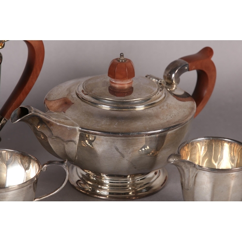 238 - A FOUR PIECE SILVER TEA SET INCLUDING TEAPOT, SUGAR BOWL, HOT WATER AND CREAM JUG, all of tapered fa... 