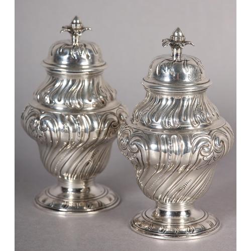 242 - A PAIR OF GEORGE II SILVER CADDIES, Alexander Johnson, London 1757, of writhen baluster vase form wi... 