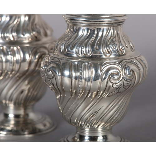 242 - A PAIR OF GEORGE II SILVER CADDIES, Alexander Johnson, London 1757, of writhen baluster vase form wi... 