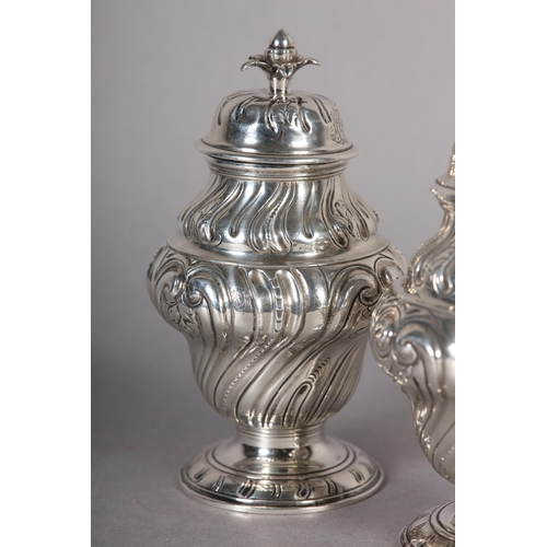 242 - A PAIR OF GEORGE II SILVER CADDIES, Alexander Johnson, London 1757, of writhen baluster vase form wi... 