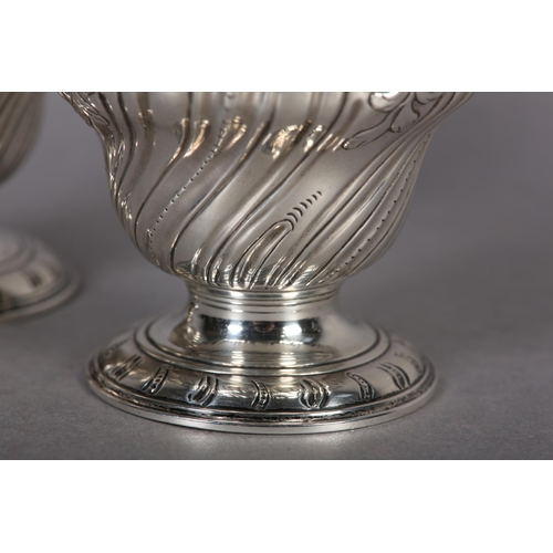 242 - A PAIR OF GEORGE II SILVER CADDIES, Alexander Johnson, London 1757, of writhen baluster vase form wi... 