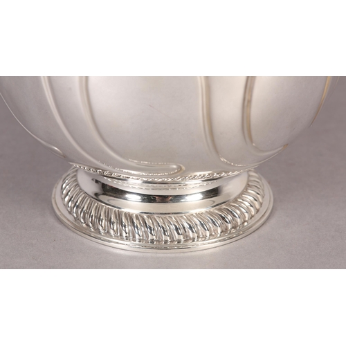 245 - AN EDWARD VII SILVER BOWL, London 1908, circular, the bowl embossed with writhen scrolls beneath a f... 