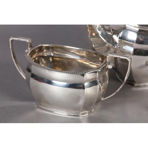 246 - A GEORGE V SILVER FOUR PIECE TEA AND COFFEE SERVICE of oblong baluster outline with egg and dart rim... 