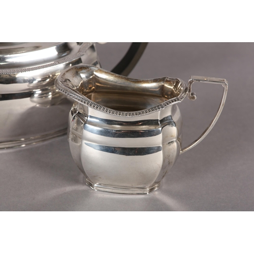 246 - A GEORGE V SILVER FOUR PIECE TEA AND COFFEE SERVICE of oblong baluster outline with egg and dart rim... 